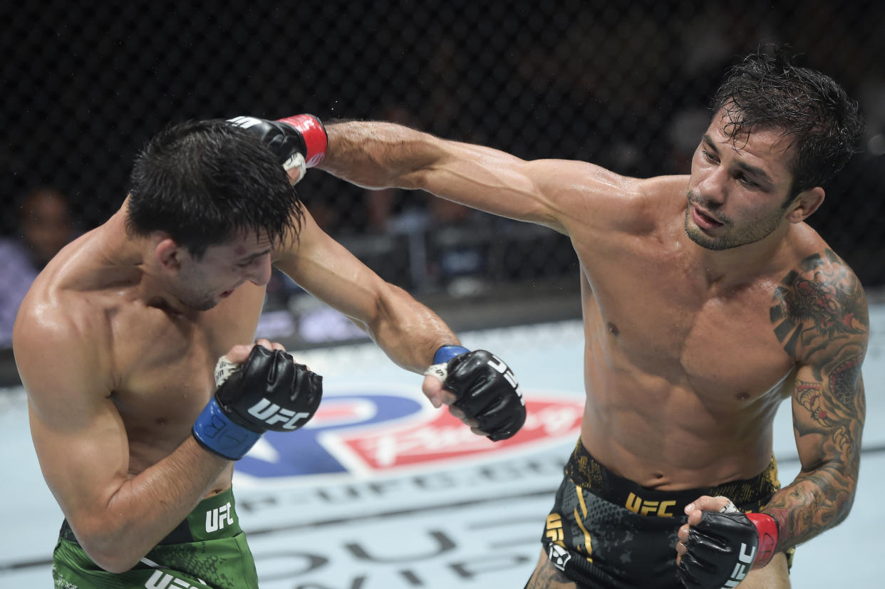 Alexandre Pantoja (right) punches Steve Erceg in a UFC flyweight championship bout during the UFC 301 event at Farmasi Arena on Saturday in Rio de Janeiro, Brazil. (Photo by Alexandre Loureiro/Zuffa LLC via Getty Images)