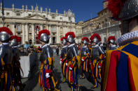 Vatican Swiss Guards parade in St. Peter's Square ahead of Pope Francis' Easter Sunday Mass in St. Peter's Square at the Vatican Sunday, April 20, 2014. Even before Mass began in late morning, more than 100,000 tourist, Romans and pilgrims, young and old, had turned out for the Mass. Many more streamed in throughout the ceremony, and the broad boulevard leading from the square to the Tiber river filled up with the faithful and the curious, trying to catch a glimpse of the pontiff at the altar under a canopy erected on the steps of St. Peter's Basilica. (AP Photo/Andrew Medichini)