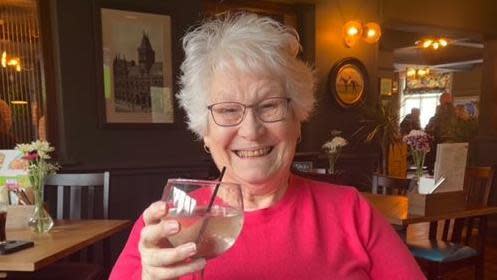 Barbara Spencer holding a drink