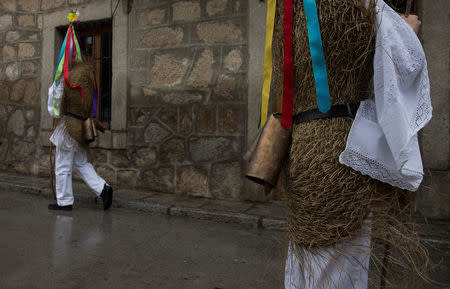 Revellers, dressed as "Zarramaches", walk through the streets during celebrations to mark Saint Blaise's festivity in Casavieja, Spain February 3, 2017. REUTERS/Sergio Perez