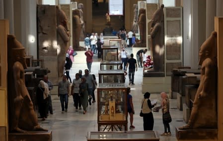 FILE PHOTO: Tourists look at artefacts inside the Egyptian Museum in Cairo