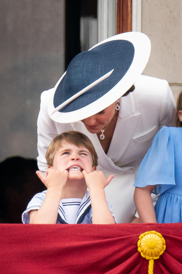 The Duchess of Cambridge speaks to prince Louis as he pulls a face on the balcony of Buckingham Palace, to view the Platinum Jubilee flypast, on day one of the Platinum Jubilee celebrations. Picture date: Thursday June 2, 2022. (Photo by Aaron Chown/PA Images via Getty Images)