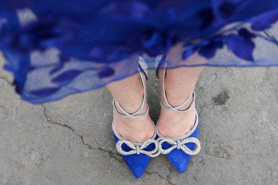 Genevieve Wilhelm wears royal blue heals with rhinestones by Gianni Bini at Churchill Downs in Louisville, Ky., Saturday, May 4, 2024. Amy Wallot