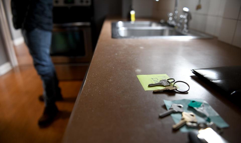 Keys sit on the counter as John Hunt does a final walk through of his new North Canton home with Realtor Tiffany Pepper of Keller Williams Legacy Group.