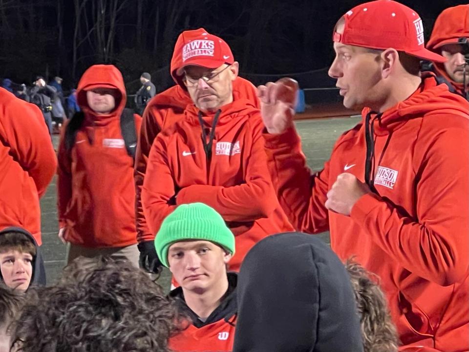Hudson High head football coach Zac Attaway talks with the team after they were defeated by Fairhaven in the Division 6 state semifinals on Nov. 18, 2023.