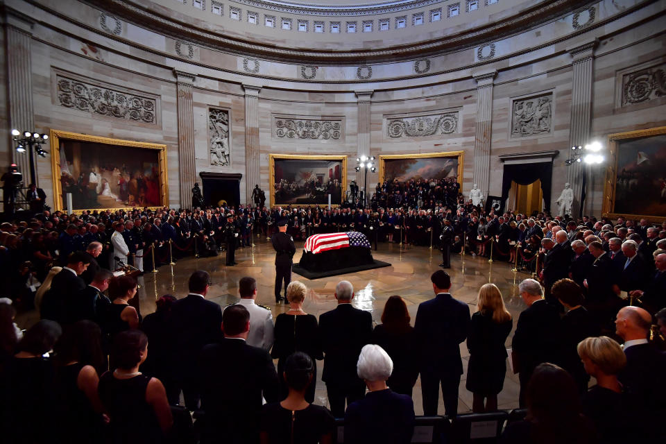 Mourners surround McCain's casket in the Capitol rotunda.