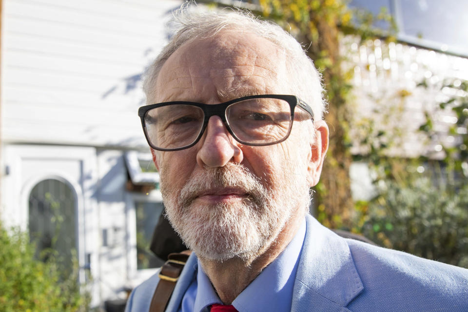 Britain's former opposition Labour Party leader Jeremy Corbyn leaves his home in London, Wednesday Nov. 18, 2020. Corbyn will be reinstated into the political party it is announced Wednesday after a three-week suspension as Labour’s National Executive Committee seeks to draw a line under years of tumultuous divisions over alleged anti-Jewish prejudice in the party. (Aaron Chown/PA via AP)