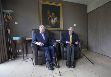 The world's oldest living twin brothers, Paulus (L) and Pieter Langerock from Belgium, 102, sit in their living room at the Ter Venne care home in Sint-Martens-Latem, Belgium August 11, 2015. REUTERS/Yves Herman