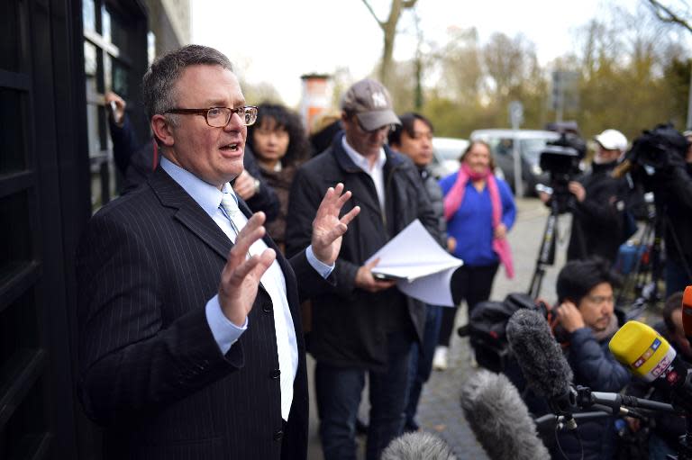 Christoph Kumpa (L), spokesman of Duesseldorf's public prosecution, and addresses journalists on March 30, 2015 in front of the prosecution building in Duesseldorf, western Germany