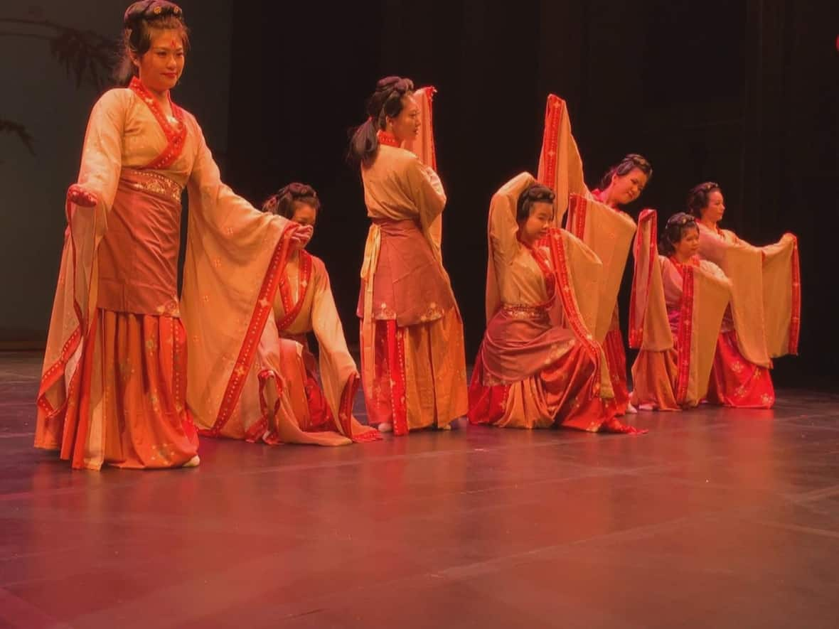 Dancers in traditional Chinese dress practised their performance for the annual Chinese New Year gala at the Fredericton Playhouse. (Hannah Rudderham/CBC - image credit)