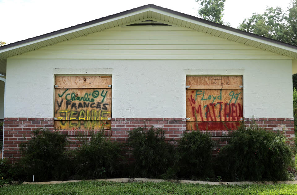 DAYTONA BEACH, FL - SEPTEMBER 09:  Wood storm shutters bear the names of past hurricanes ahead of the arrival of Hurricane Irma September 9, 2017 in Daytona Beach, Florida. Governor Rick Scott has ordered the mandatory evacuation of millions of people from the southern part of the state ahead of the unprecedented storm.  (Photo by Chip Somodevilla/Getty Images)