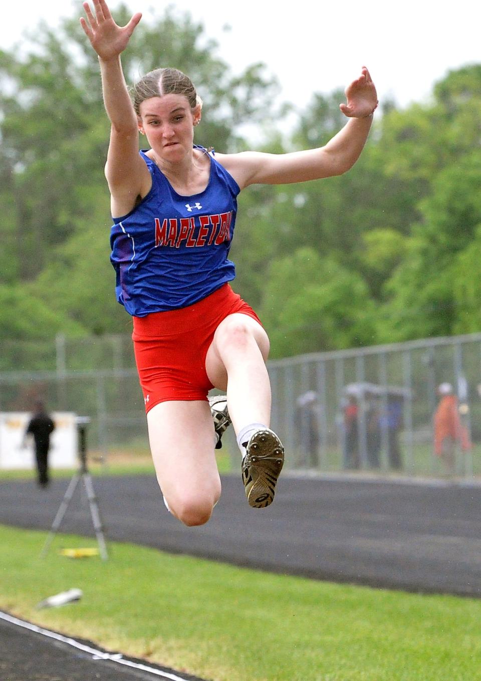 Mapleton's Madison Bailey competes in the girls long jump at the Division III Perry Regional on Friday.