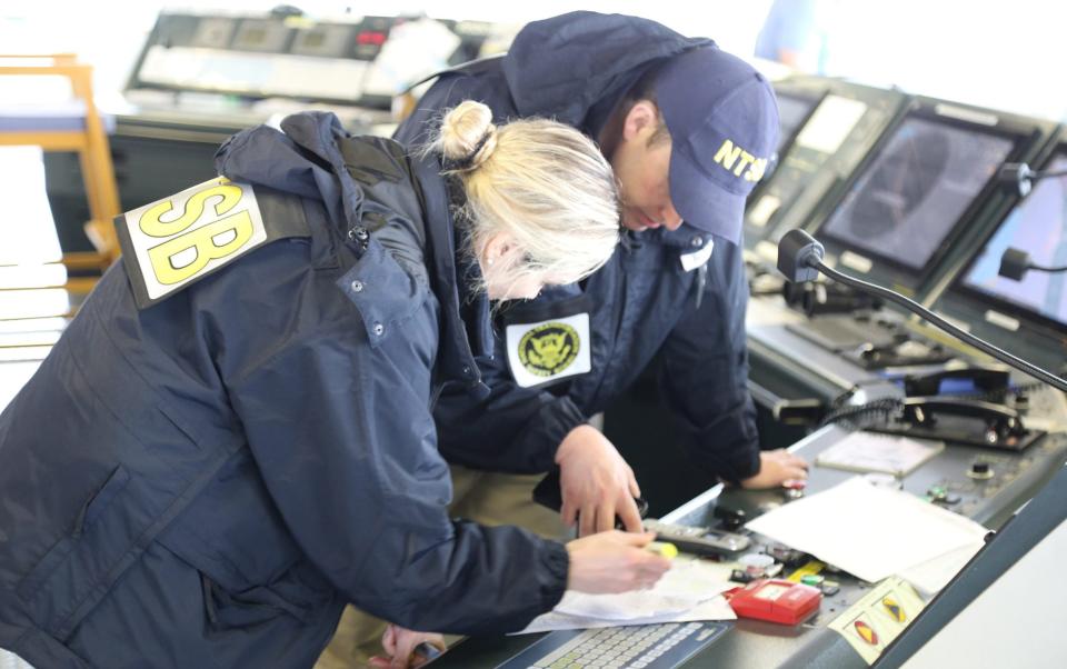 NTSB investigators on the cargo vessel Dali