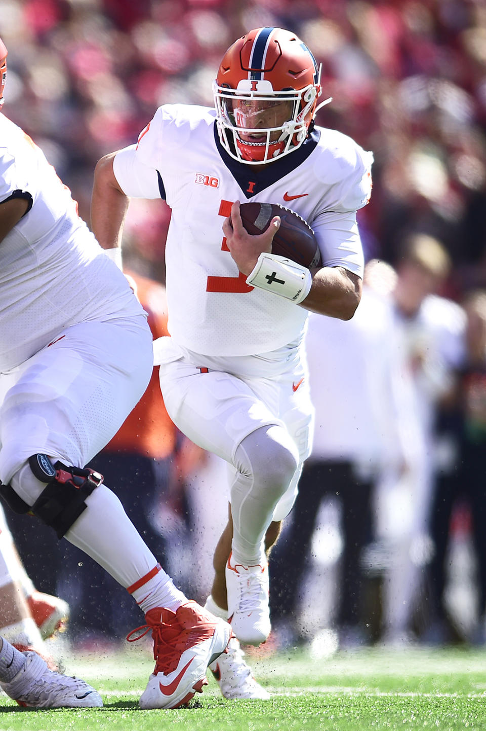 Illinois quarterback Tommy DeVito (3) runs the ball against Wisconsin during the first half of an NCAA college football game Saturday, Oct. 1, 2022, in Madison, Wis. (AP Photo/Kayla Wolf)