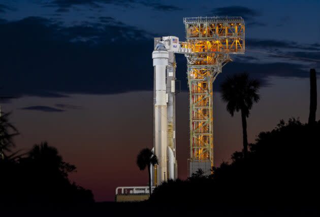 United Launch Alliance's Atlas V rocket stands on its Florida launch pad at sunset, topped by Boeing's gumdrop-shaped Starliner space capsule.  (ULA photo)