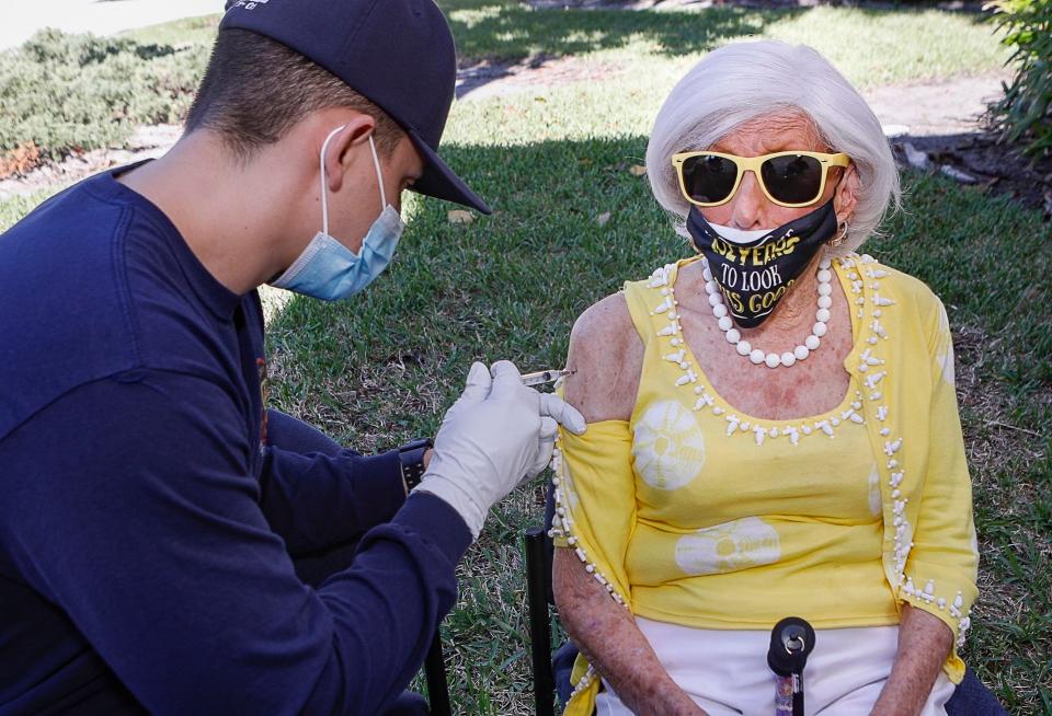 Palm Beach resident Jane Smith, 102, is administered the COVID-19 Moderna vaccine at Fire Rescue Station #3, Tuesday, January 5, 2021. "I didn't feel a thing," Smith said. DAMON HIGGINS/PALM BEACH DAILY NEWS