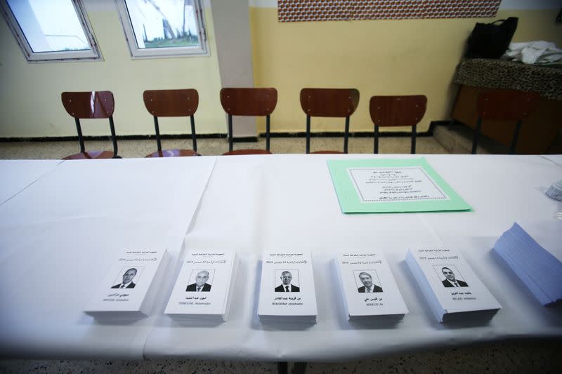 Ballot papers of the five presidential candidates are displayed at a polling station in Algiers