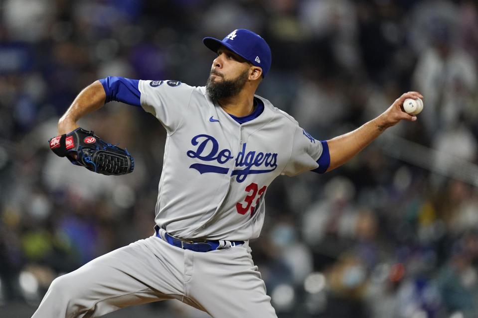 Los Angeles Dodgers relief pitcher David Price works against the Colorado Rockies in the seventh inning of a baseball game Friday, April 2, 2021, in Denver. (AP Photo/David Zalubowski)