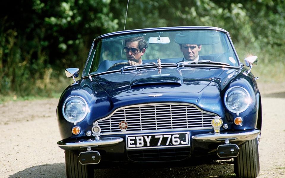 Charles in his Aston Martin Db5, which he is said to have converted to run on surplus English white wine and whey from the cheese process - Tim Graham Photo Library