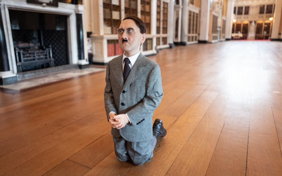 Him (2001), Cattelan's notorious sculpture of a kneeling boy with the adult face of Adolf Hitler
