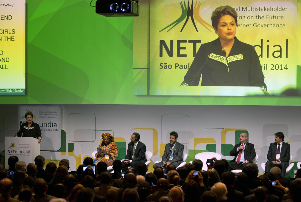 Brazil's President Dilma Rousseff addresses the opening ceremony of NETmundial, a major conference on the future of Internet governance in Sao Paulo, Brazil, Wednesday, April 23, 2014. Rousseff ratified a bill guaranteeing Internet privacy and enshrining access to the Web during the conference. The legislation, which was passed by the Senate late Tuesday, puts limits on the metadata that can be collected from Internet users in Brazil. It also makes Internet service providers not liable for content published by their users and requires them to comply with court orders to remove offensive material. (AP Photo/Andre Penner)