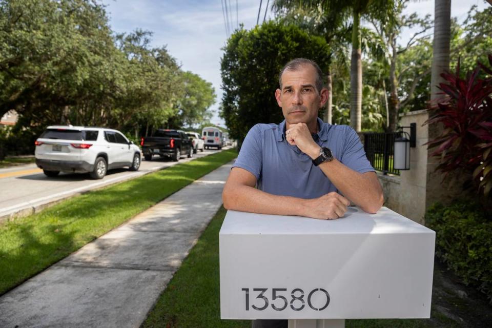 Dean Warhaft is photographed in front of his home on Wednesday, June 28, 2023, in Pinecrest, Florida. Miami-Dade County is planning to build a traffic circle near Warhaft’s home at the intersection of Southwest 67th Avenue and Southwest 136th Street. Residents are now suing the county claiming the traffic circle would destroy trees and ruin the character of their streets.
