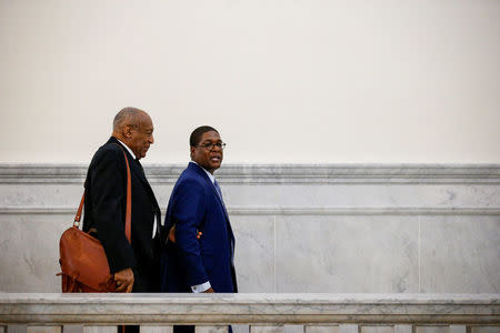 Actor and comedian Bill Cosby exits, with his publicist Andrew Wyatt, following a pretrial hearing for his sexual assault trial at the Montgomery County Courthouse in Norristown, Pennsylvania, U.S. March 6, 2018. REUTERS/Brendan McDermid