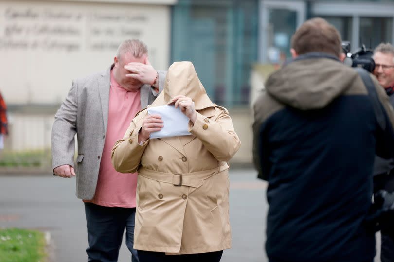 Bernard McDonagh (left) and Ann McDonagh (centre) both covered their faces as they were spotted by members of the media arriving at court -Credit:John Myers/WalesOnline