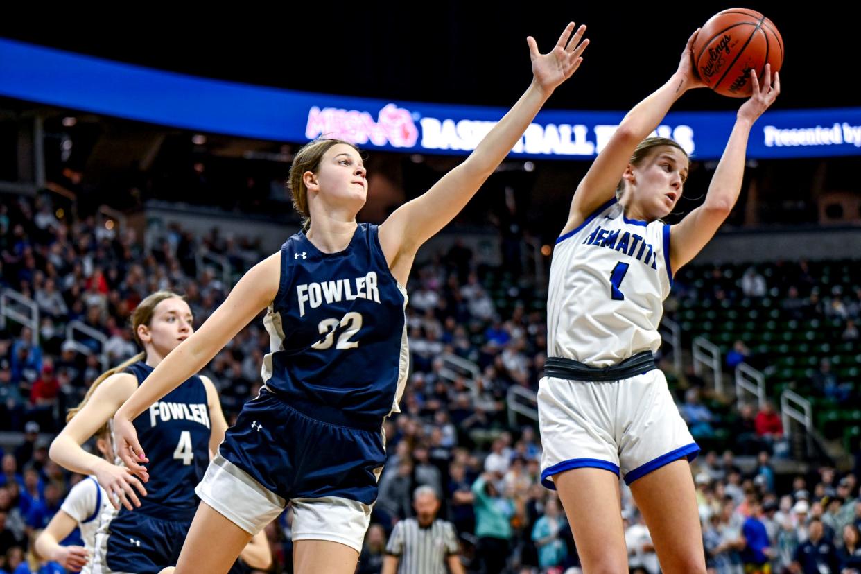 Ishpeming's Jenna Maki, right, pulls down a rebound in front of Fowler's Isabella Halfmann during the first quarter in the Division 4 girls basketball state semifinal on Thursday, March 21, 2024, at the Breslin Center in East Lansing.