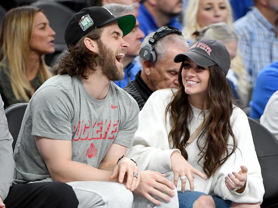 Bryce Harper (L) and his wife Kayla Harper attend a game between the Ohio State Buckeyes and the Kentucky Wildcats during the CBS Sports Classic at T-Mobile Arena on December 21, 2019 in Las Vegas, Nevada