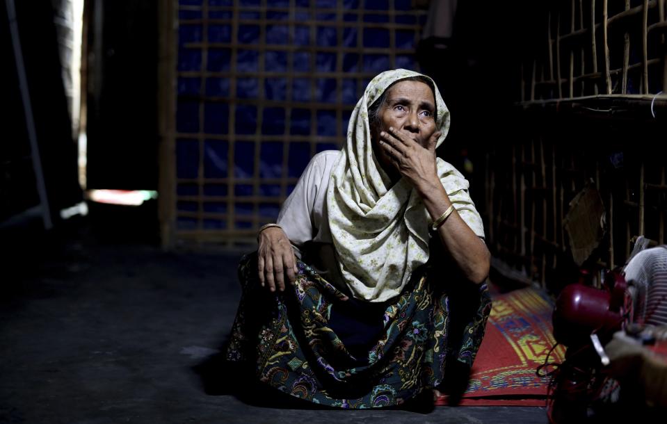 In this photograph taken Aug. 28, 2018, an elderly Rohingya refugee Noor Aisha Khatun, who used to visit spiritual healers, sits inside the family shelter in Kutupalong refugee camp, Bangladesh. Faith healers have long been sought out in Rohingya society to treat physical and mental ailments. Their trade has thrived in part because of traditional beliefs and in part because Rohingya have lacked access to modern medical care in Buddhist-majority Myanmar, where they are one of the most persecuted minority groups in the world. Access to medical care has changed for the better in the refugee camps in Bangladesh, yet many Rohingya still seek out their faith healers. (AP Photo/Altaf Qadri)