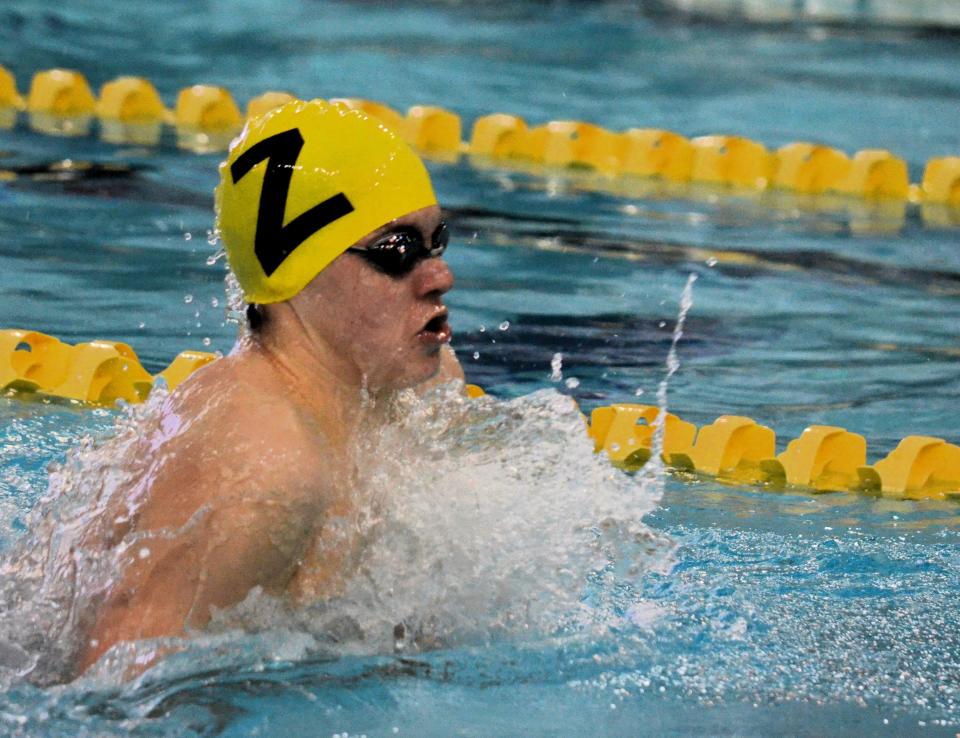 Zeeland's Owen Stevens swims the 200 individual medley on Tuesday, Jan. 30, 2024, at Holland Community Aquatic Center.
