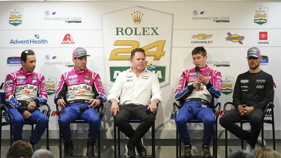 The Meyer Shank Racing team, from left, Helio Castroneves, Simon Pagenaud, Michael Shank, Colin Braun and Tom Blomqvist attend a news conference for the Rolex 24 hour auto race at Daytona International Speedway, Thursday, Jan. 26, 2023, in Daytona Beach, Fla. (AP Photo/John Raoux)