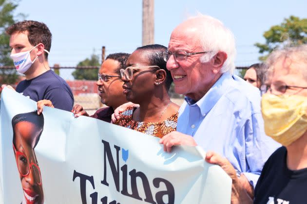 Minnesota Attorney General Keith Ellison (center left) and Sen. Bernie Sanders (center right) march to the polls with congressional candidate Nina Turner (center) on Saturday. (Photo: Michael M. Santiago/Getty Images)