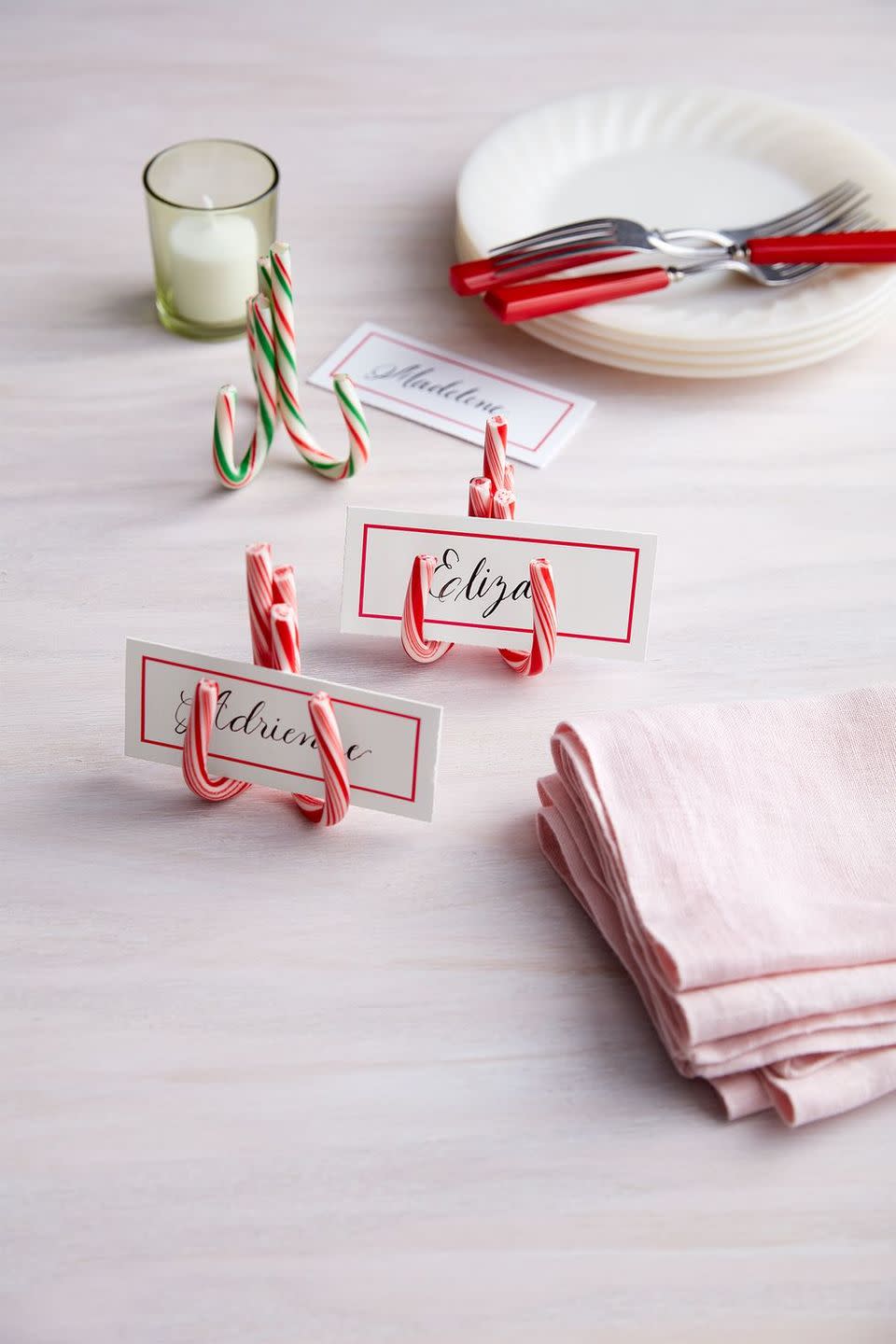 <p>Sure, these easy glued-together candy cane place cardholders look elegant with calligraphy. But they're much cuter when kids take over the task of writing guests' names.</p><p><a class="link " href="https://www.amazon.com/dp/B07G485YMQ?tag=syn-yahoo-20&ascsubtag=%5Bartid%7C10055.g.34112389%5Bsrc%7Cyahoo-us" rel="nofollow noopener" target="_blank" data-ylk="slk:Shop Now;elm:context_link;itc:0;sec:content-canvas">Shop Now</a></p>