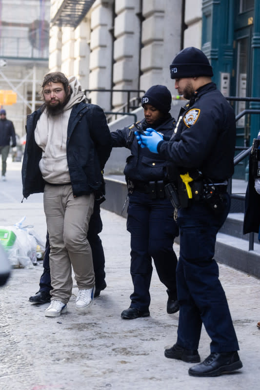 New York Police are seen detaining a suspected stalker outside Taylor Swift's apartment in Tribeca on Jan. 20, 2024, in New York City.<p>Gotham/GC Images</p>