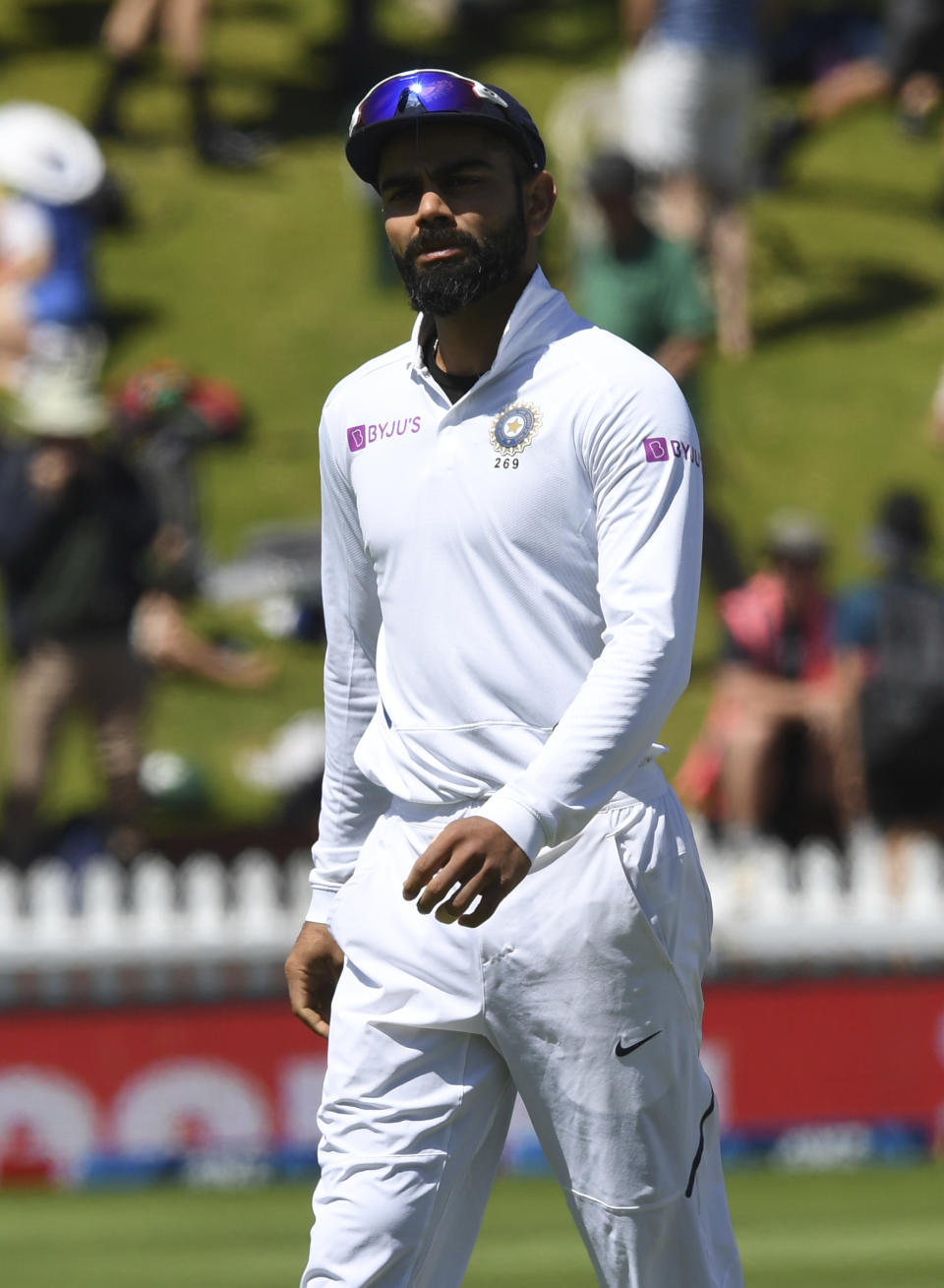 India's captain Virat Kohli walks off the field following his team's ten wicket loss during the first cricket test between India and New Zealand at the Basin Reserve in Wellington, New Zealand, Monday, Feb. 24, 2020. . (AP Photo/Ross Setford)