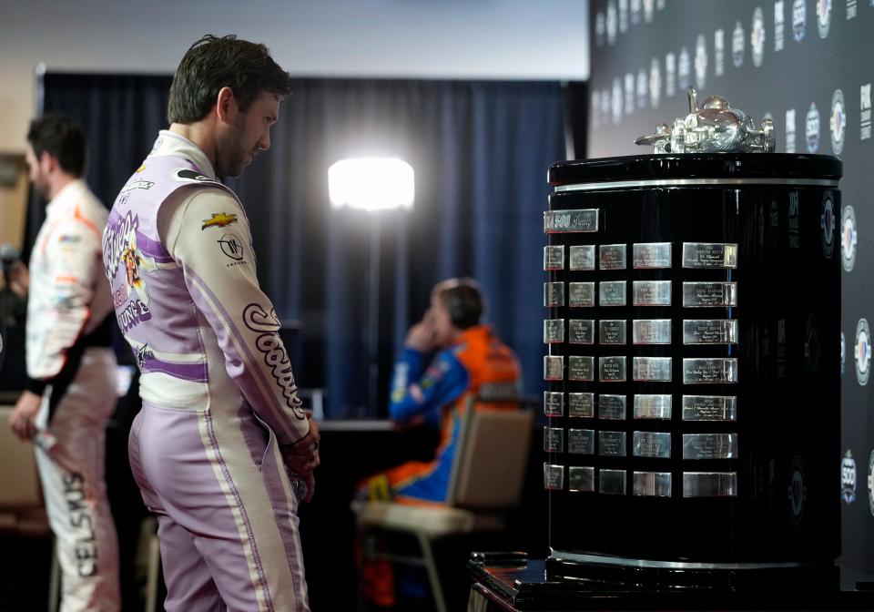 Daniel Suarez eyes the Harley J. Earl trophy during NASCAR Media Day at Daytona International Speedway, Wednesday, Feb. 15, 2023 