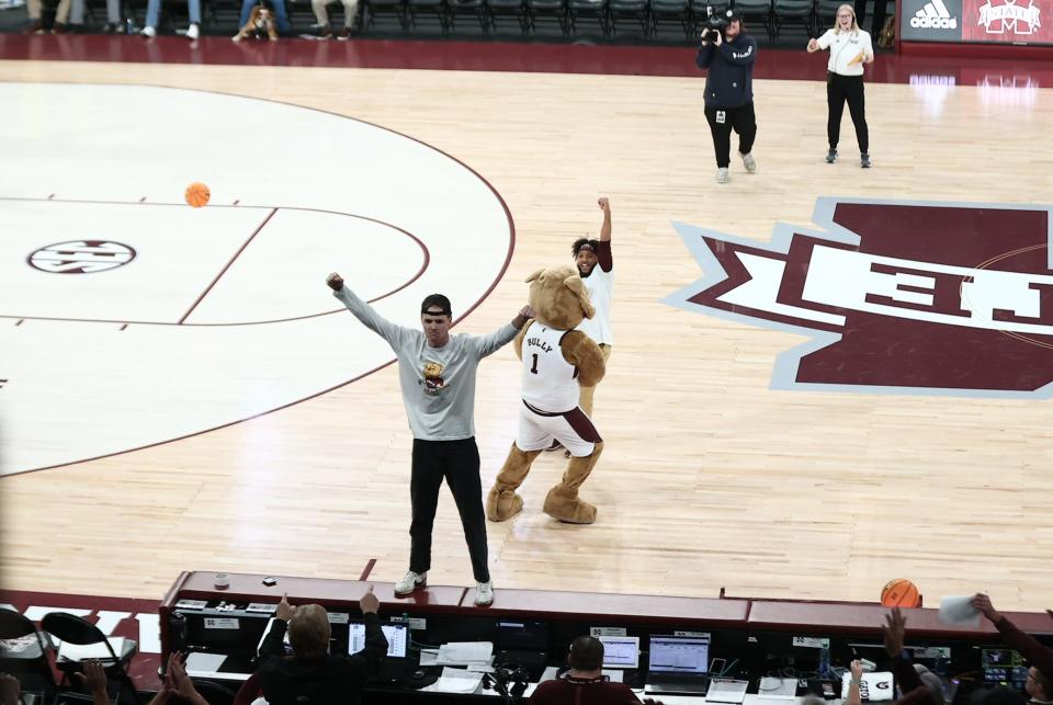 Mississippi State senior Brooks Bryant celebrates making a halfcourt shot during halftime of a Nov. 28, 2022, matchup between MSU basketball and Omaha.