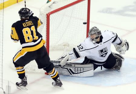 Dec 15, 2018; Pittsburgh, PA, USA; Pittsburgh Penguins right wing Phil Kessel (81) scores the game winning goal against Los Angeles Kings goaltender Jonathan Quick (32) in overtime at PPG PAINTS Arena. The Penguins won 4-3. Mandatory Credit: Charles LeClaire-USA TODAY Sports