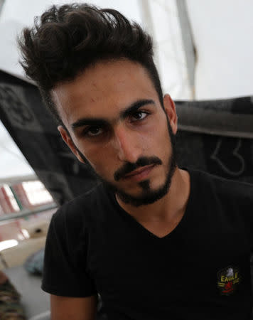 Daman Ayed, a 20-year old former rescue worker with the White Helmets is seen at a temporary camp in Aleppo countryside, Syria July 23, 2018. Picture taken July 23, 2018. REUTERS/Khalil Ashawi