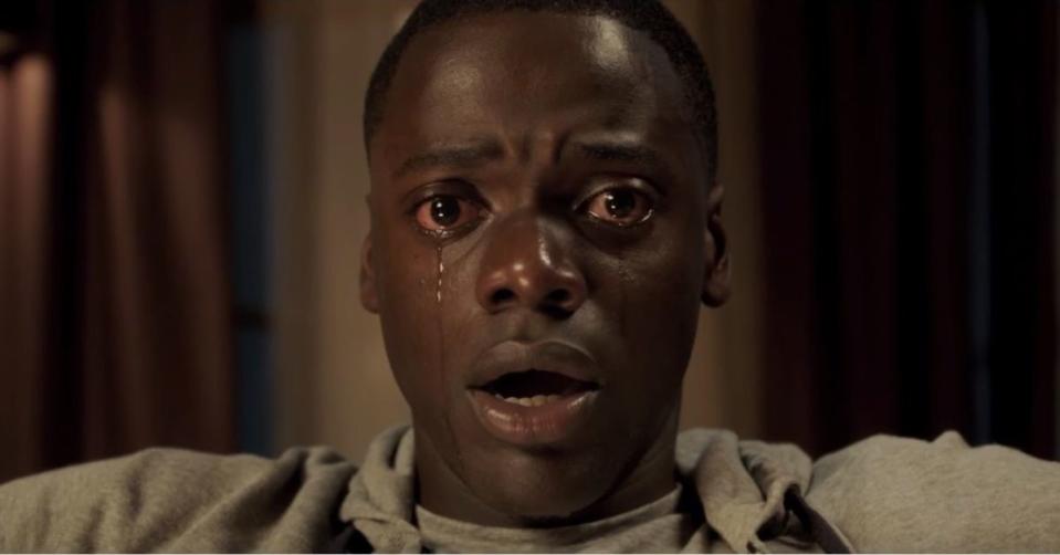 A still from Get Out shows daniel kaluuya staring out at the screen frozen in terror