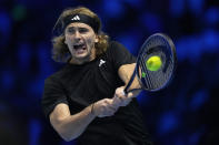 Germany's Alexander Zverev returns the ball to Russia's Andrey Rublev during their singles tennis match of the ATP World Tour Finals at the Pala Alpitour, in Turin, Italy, Friday, Nov. 17, 2023. (AP Photo/Antonio Calanni)
