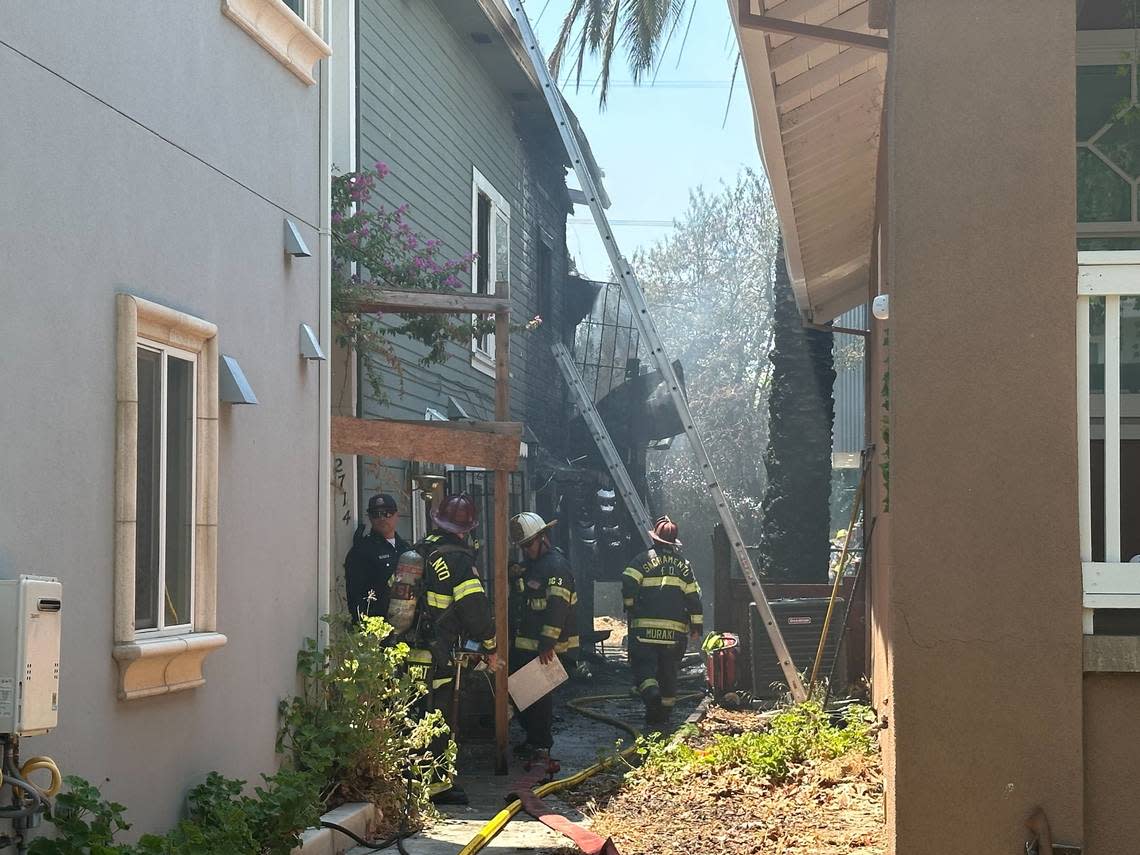 A two-alarm fire burns Friday afternoon at 2714 T Street in midtown Sacramento.