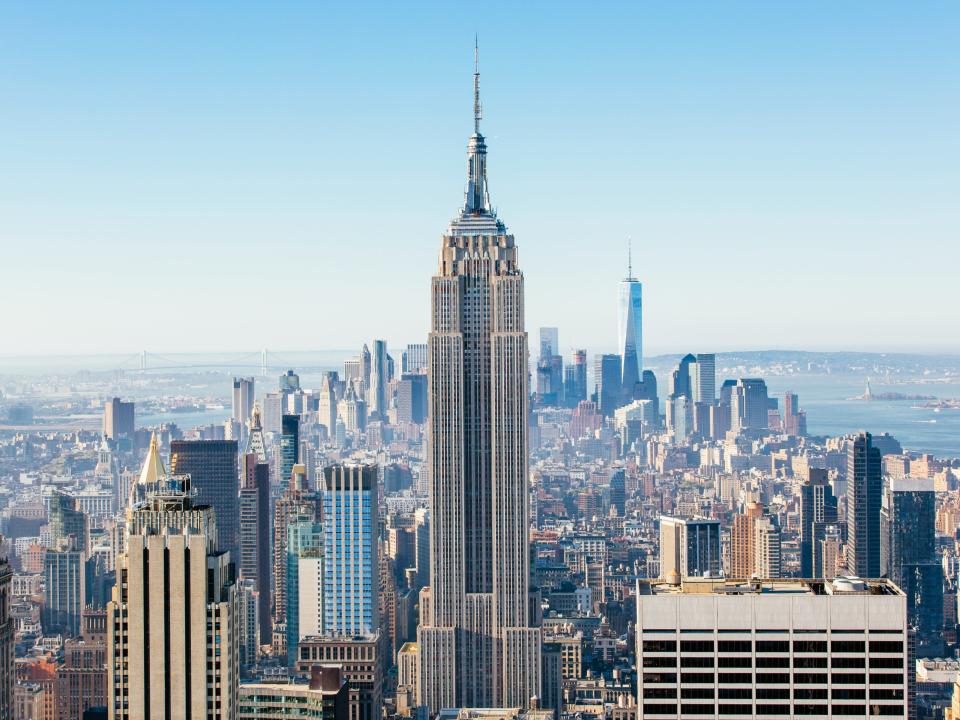 New York cityscape seen from above with the Empire State Building in view.