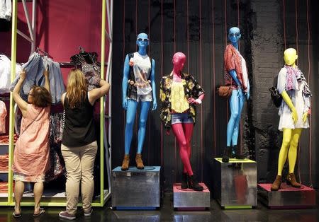 Customers shop at a Primark store on Oxford Street in London June 20, 2014. REUTERS/Luke MacGregor