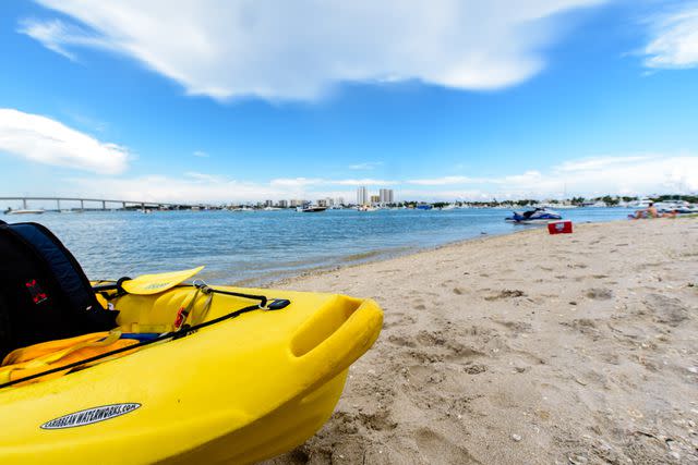 <p>Discover The Palm Beaches Press Site</p><p> </p> Kayak parked on the beach of Peanut Island.