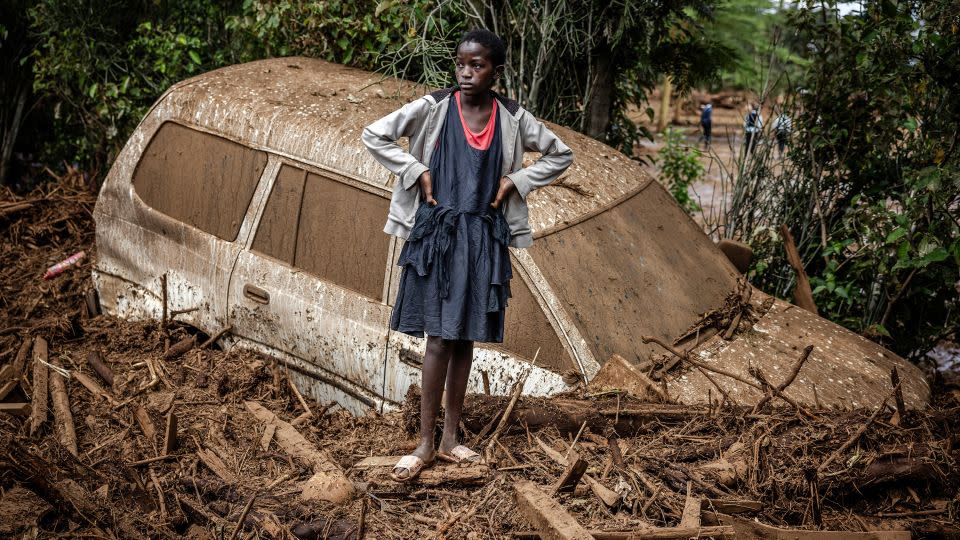 A damaged car buried in mud in an area heavily affected by torrential rains and flash floods in the village of Kamuchiri, near Mai Mahiu, on April 29. - Luis Tato/AFP via Getty Images
