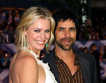 Rebecca Romijn Stamos and John Stamos at the Hollywood premiere of 20th Century Fox's X2: X-Men United