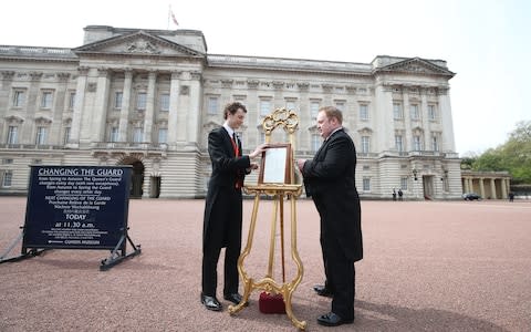 An easel is placed in the Forecourt of Buckingham Palace in London to announce the birth of a baby girl. - Credit: Steve Parsons /PA